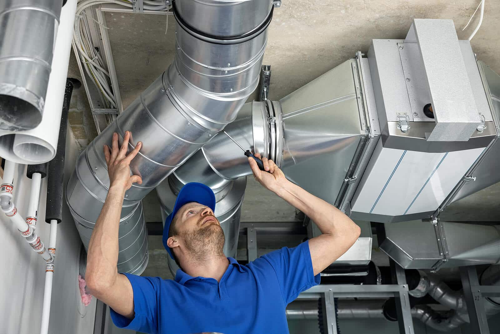 HVAC technician inspecting and repairing air ducts in Camarillo