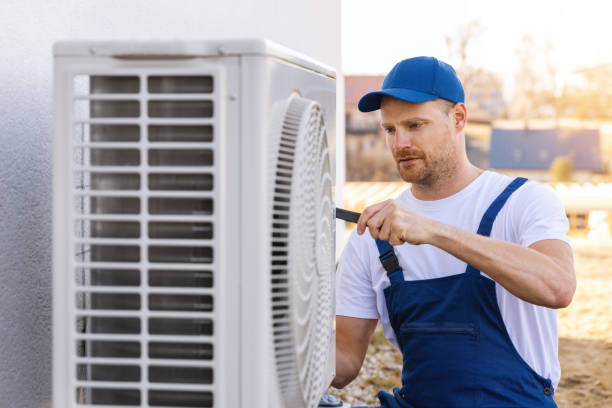 HVAC technician servicing an outdoor air conditioner in Camarillo